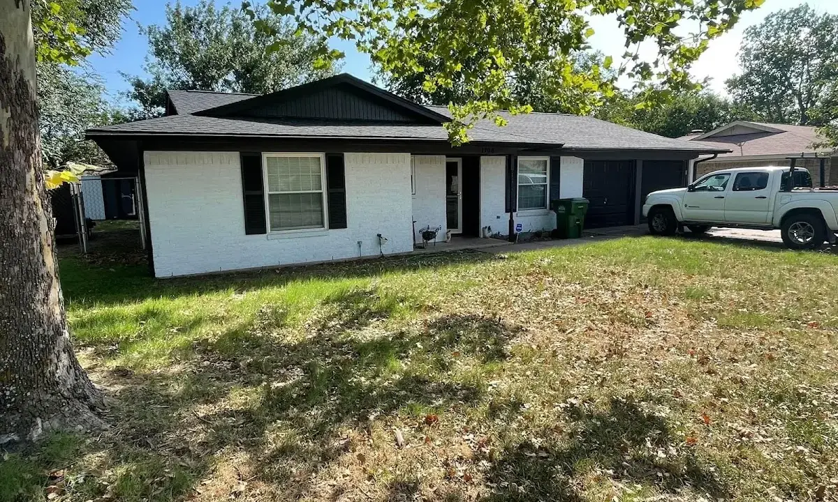 Professional roofing crew working on a residential roof in North Port